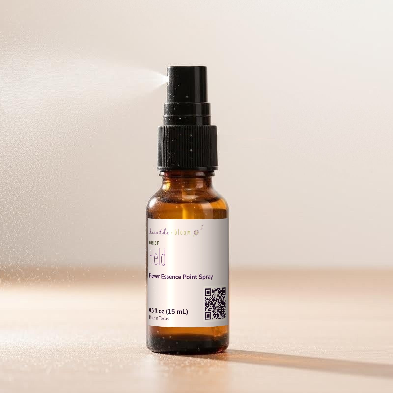 Held Point Spray, shown on a ½ oz amber spray bottle