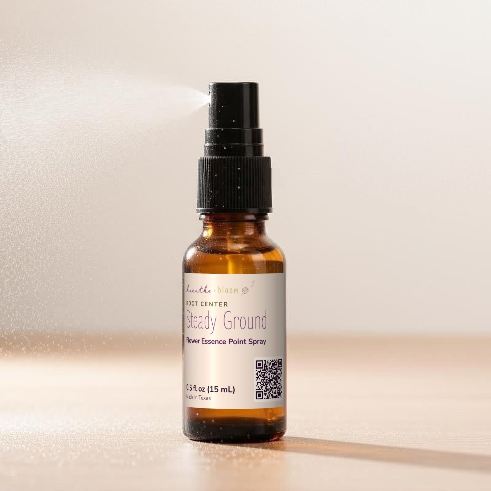 Root · Steady Ground Point Spray, shown on a ½ oz amber spray bottle